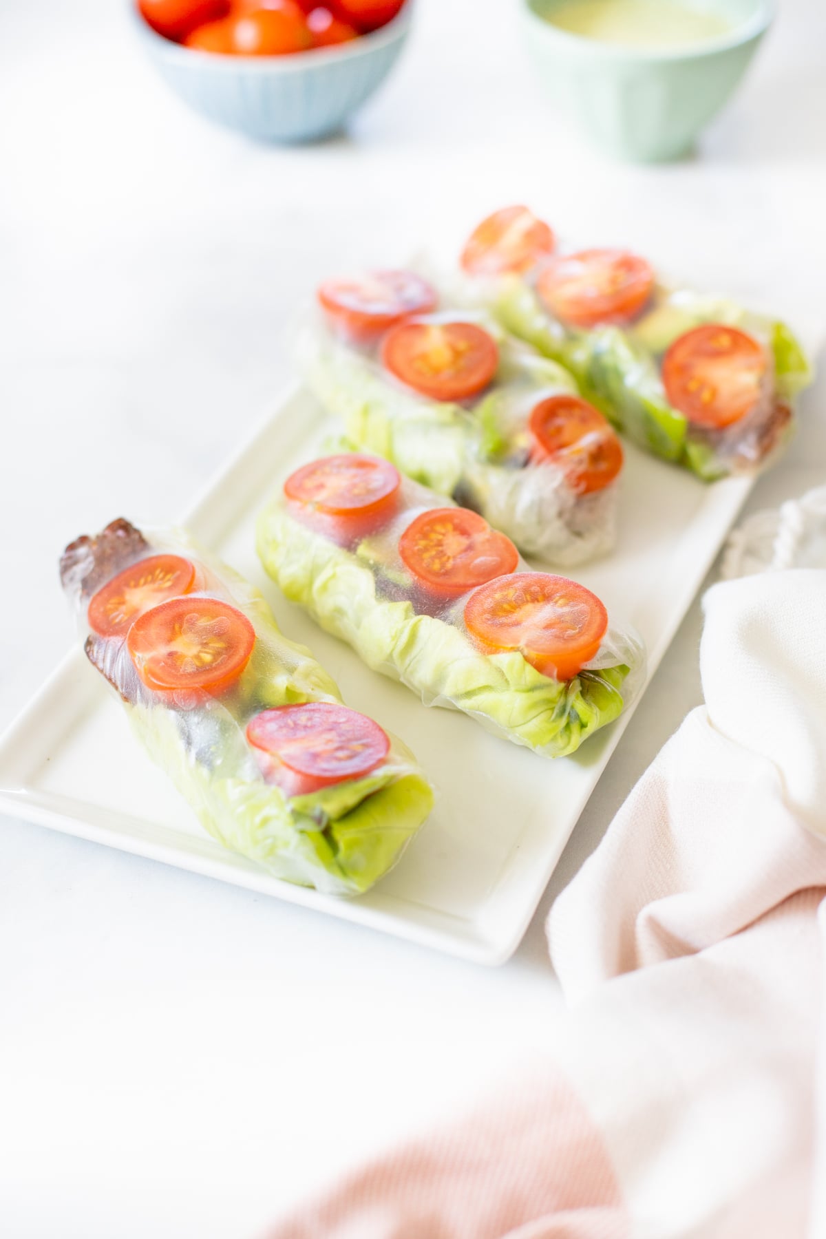 These Vegan BLT Summer Rolls are the perfect cold lunch or snack. Loaded with tempeh bacon, cherry tomatoes, butter lettuce & avocado. Served with Vegan Cilantro Ranch | ThisSavoryVegan.com #thissavoryvegan #summerrolls #veganblt