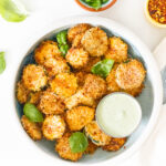 These Air Fryer Zucchini Chips with Vegan Basil Aioli are the best snack idea! They are crispy, flavor-packed and a healthier version of chips | ThisSavoryVegan.com #thissavoryvegan #airfryerrecipe #zucchinirecipes