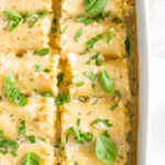 These Vegan Pumpkin Lasagna Roll Ups are filled with vegan ricotta, fresh herbs & pumpkin before being topped with a creamy vegan sauce! Perfect dinner for a cold night | ThisSavoryVegan.com #thissavoryvegan #veganlasagna #pumpkinlasagna
