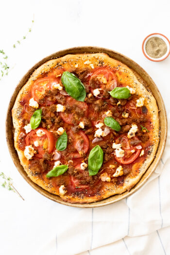 This Vegan Sausage & Ricotta Pizza has the perfect amount of crunch, spice and fresh flavors. A better than takeout vegan pizza you will want to make every Friday | ThisSavoryVegan.com #thissavoryvegan #veganpizza #vegandinner
