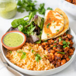 These Vegan Bean & Rice Plates are a super simple dinner recipe that comes together in just 30 minutes. Served with mixed greens and mini quesadillas | ThisSavoryVegan.com #thissavoryvegan #riceandbeans #veganquesadillas