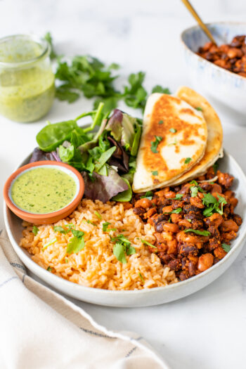 These Vegan Bean & Rice Plates are a super simple dinner recipe that comes together in just 30 minutes. Served with mixed greens and mini quesadillas | ThisSavoryVegan.com #thissavoryvegan #riceandbeans #veganquesadillas