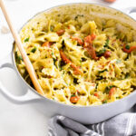 This Creamy Vegan Pesto Pasta is loaded with roasted red peppers, kale, fresh basil and lemon zest. A one-pot vegan dinner that is ready in 30 minutes | ThisSavoryVegan.com #thissavoryvegan #veganpasta #pestopasta
