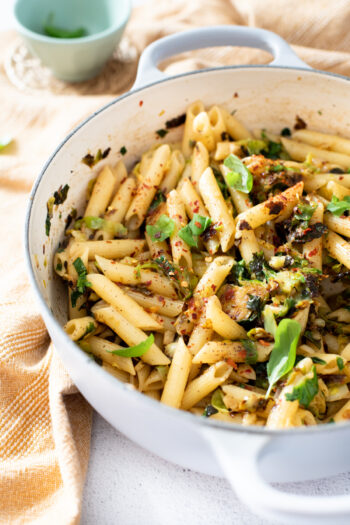 This Penne with Crispy Brussels Sprouts is a simple vegan pasta that is loaded with garlic, shallot, red pepper flakes & herbs | ThisSavoryVegan.com #thissavoryvegan #vegandinnerideas #veganpasta
