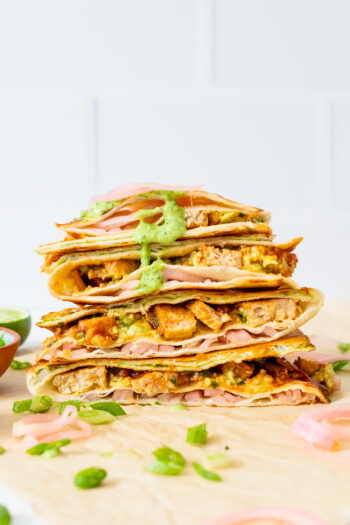 This Vegan BBQ Chicken Folded Wrap is inspired by the tiktok trend! A toasty wrap with avocado, pickled onions, a creamy sauce & vegan chicken. All in a compact tortilla you can take on the go | ThisSavoryVegan.com #thissavoryvegan #tiktokwrap #veganwrapideas