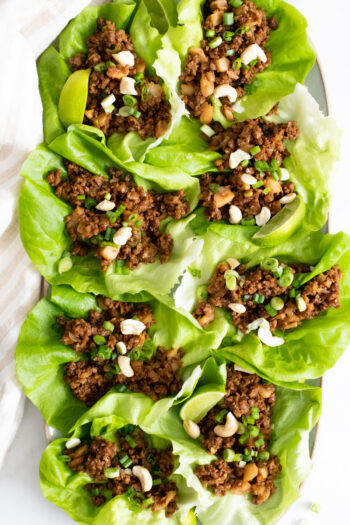 These Vegan Beef Lettuce Wraps are the perfect light meal. Loaded with vegan beef crumbles, a hoisin sauce and crunchy water chestnuts | ThisSavoryVegan.com #thissavoryvegan #veganappetizer #lettucewraps