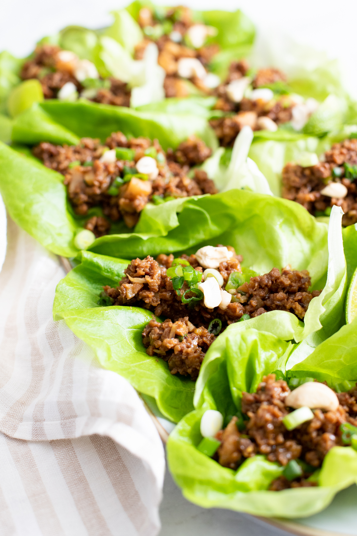 These Vegan Beef Lettuce Wraps are the perfect light meal. Loaded with vegan beef crumbles, a hoisin sauce and crunchy water chestnuts | ThisSavoryVegan.com #thissavoryvegan #veganappetizer #lettucewraps