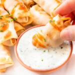 These Vegan Buffalo Chicken Mini Egg Rolls are the perfect party snack. These bite-sized appetizers are served with vegan ranch & extra hot sauce | ThisSavoryVegan.com #thissavoryvegan #veganeggrolls #gamedaysnacks