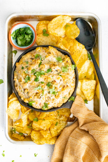 This Vegan Roasted Poblano Corn Dip is the perfect game day snack. Deliciously creamy and slightly spicy - dig in with your fave chips | ThisSavoryVegan.com #thissavoryvegan #vegangamedaysnacks #corndip