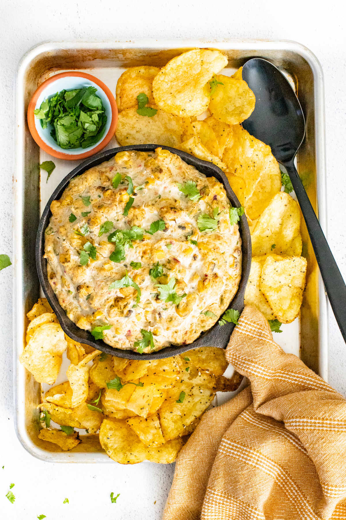 This Vegan Roasted Poblano Corn Dip is the perfect game day snack. Deliciously creamy and slightly spicy - dig in with your fave chips | ThisSavoryVegan.com #thissavoryvegan #vegangamedaysnacks #corndip