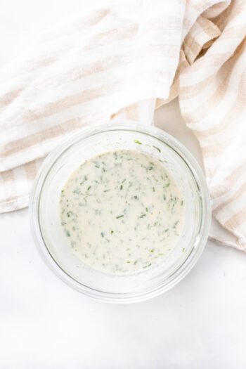 This Vegan Yogurt Ranch Dressing is a lightened up version of the classic. Use it on salads, with veggies, on pizza...anywhere you would use ranch | ThisSavoryVegan.com #thissavoryvegan #veganranch #yogurtranch