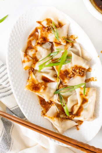 These Mushroom & Cabbage Dumplings are easy to make and beyond delicious. Served up with the best spicy Sichuan peppercorns sauce | ThisSavoryVegan.com #thissavoryvegan #vegandumplings #mushroomdumplings