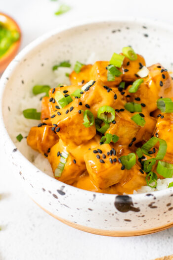 This Vegan Bang Bang Tofu is a flavor bomb. Slightly spicy, perfectly creamy & totally tasty. Serve over hot rice for a tasty vegan dinner | ThisSavoryVegan.com #thissavoryvegan #tofurecipes #vegandinnerideas