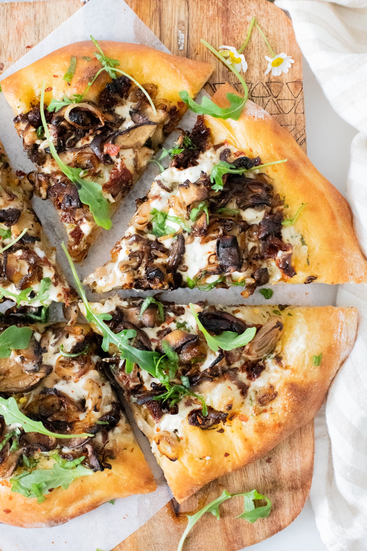 This Vegan Mushroom & Shallot White Pizza is better than takeout! Plenty of herbs, sun-dried tomatoes, creamy sauce & caramelized mushrooms | ThisSavoryVegan.com #thissavoryvegan #veganpizza #veganwhitepizza