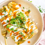 These Roasted Poblano Vegan Enchiladas are creamy, veggie-packed and super simple. A great make ahead vegan dinner | ThisSavoryVegan.com #thissavoryvegan #veganenchiladas #vegancasserole