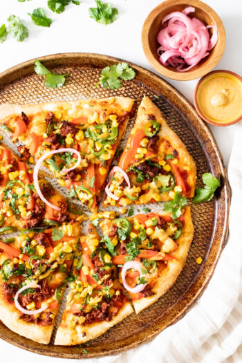 This Soyrizo Pizza with Vegan Chipotle Ranch is hearty, spicy and tasty. This no-cheese pizza combines colorful veggies with spicy soyrizo on a crispy crust | ThisSavoryVegan.com #thissavoryvegan #veganpizza #vegandinnerideas