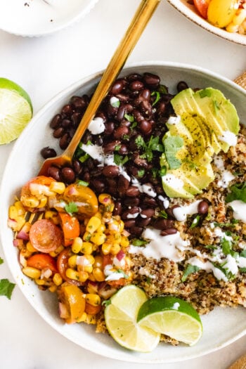 These Simple Mexican Quinoa Bowls are a great weeknight dinner or meal prepped lunch. Served with a Chipotle Cilantro Vinaigrette | ThisSavoryVegan.com #thissavoryvegan #quinoarecipes #veganmealprep