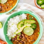 Perfect for a cold weeknight, this Slow Cooker Black Bean Soup is healthy, comforting and packed full of fiber and protein. Spice it up with your fave toppings | ThisSavoryVegan.com #thissavoryvegan #slowcookerrecipes #slowcookersoup