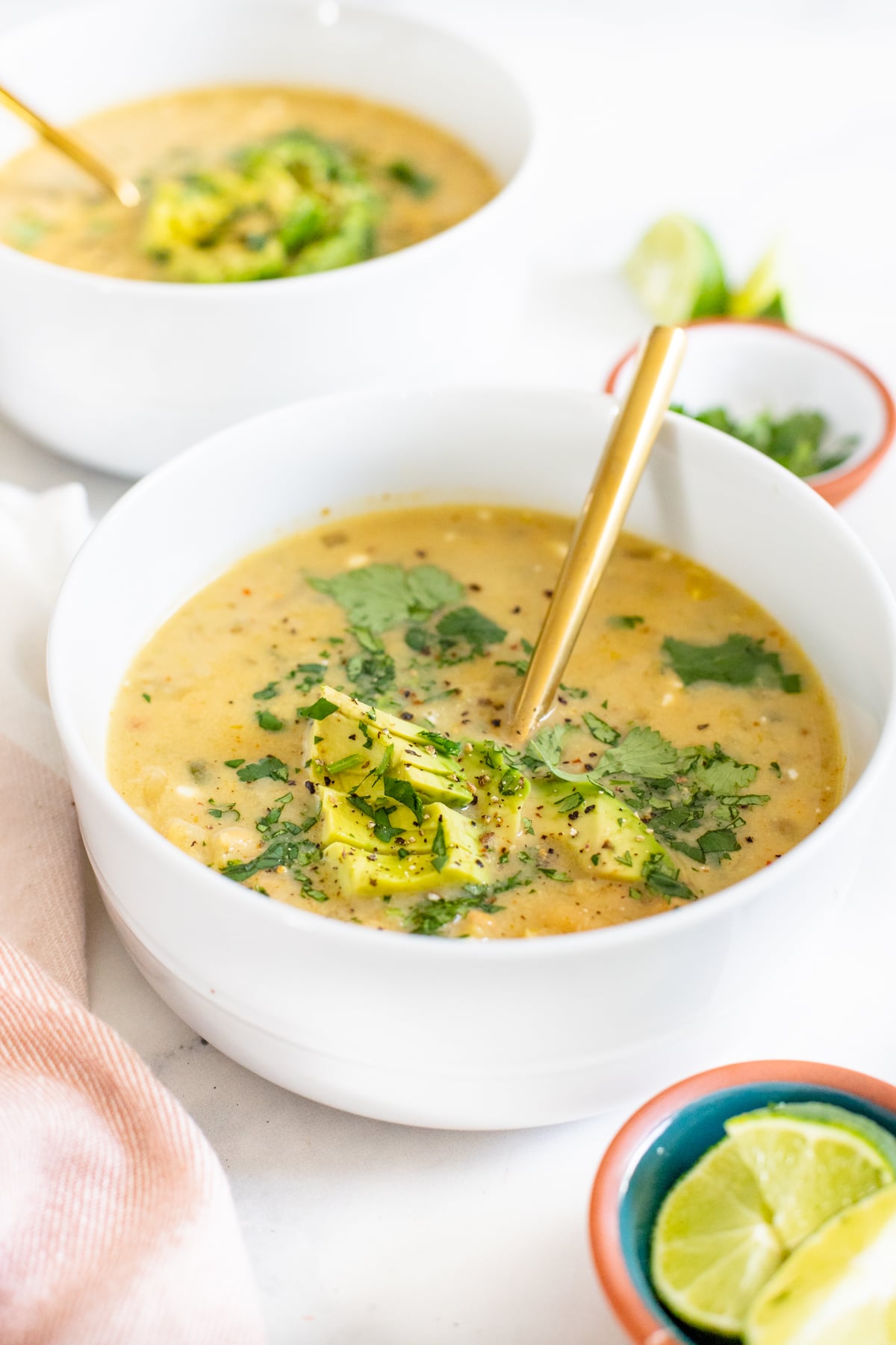 Quick, easy and delicious this Slow Cooker White Bean Enchilada Soup is the perfect vegan weeknight dinner! Stove top instructions included as well | ThisSavoryVegan.com #thissavoryvegan #slowcookerrecipe #vegansoup