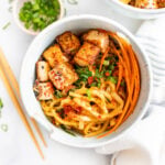 These Udon Noodles with Black Pepper Tofu are filled with crispy veggies, savory noodles and fried tofu. The perfect vegan noodle bowl | ThisSavoryVegan.com #thissavoryvegan #noodlebowls #tofurecipes