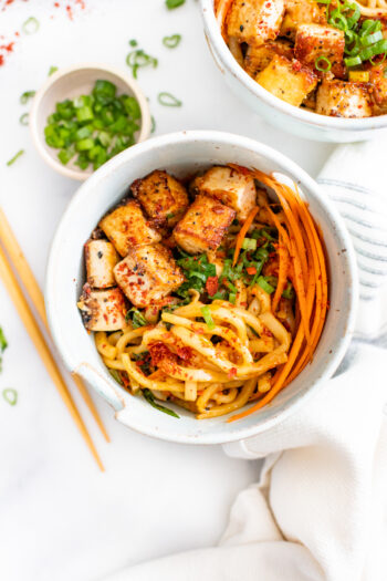 These Udon Noodles with Black Pepper Tofu are filled with crispy veggies, savory noodles and fried tofu. The perfect vegan noodle bowl | ThisSavoryVegan.com #thissavoryvegan #noodlebowls #tofurecipes
