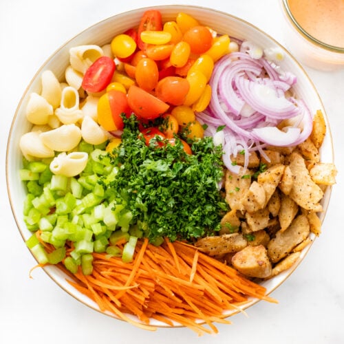 This Vegan Buffalo Chicken Pasta Salad is the perfect cold side dish. Crunchy veggies, charred vegan chicken and a zesty buffalo dressing | ThisSavoryVegan.com #thissavoryvegan #veganpastasalad #vegansidedish