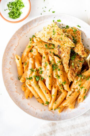 This Vegan Cajun Pasta with Panko Tempeh is comfort in a bowl. Creamy pasta, crunchy tempeh and the perfect amount of spice - a must make | ThisSavoryVegan.com #thissavoryvegan #veganpasta #tempeh