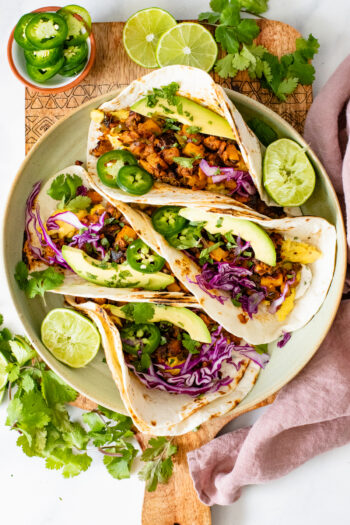 The perfect savory breakfast - these Vegan Potato & Egg Breakfast Tacos have veggies, soyrizo, scrambled vegan eggs and plenty of toppings | ThisSavoryVegan.com #thissavoryvegan #vegantacos #breakfasttacos