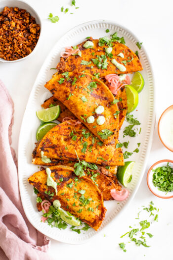 These Crispy Cauliflower Rice Tacos are layered with flavor - chipotle walnut taco "meat", refried beans, crispy shells and vegan ranch | ThisSavoryVegan.com #thissavoryvegan #vegantacos #crispytacos
