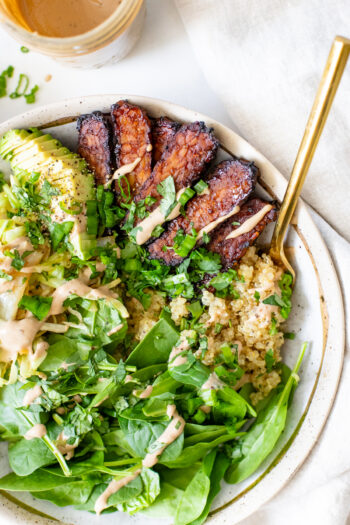 These Hoisin Tempeh Quinoa Bowls are filled with crispy tempeh, wilted cabbage, crunchy spinach, quinoa, avocado & a balsamic tahini dressing | ThisSavoryVegan.com #thissavoryvegan #tempehrecipes #quinoabowls
