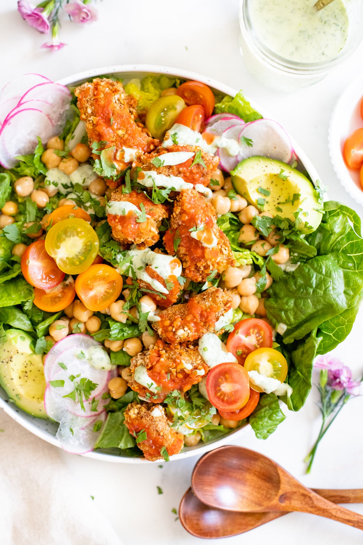 This Pretzel Crusted Buffalo Tempeh Salad has crunchy veggies, buffalo pretzel crusted tempeh and a creamy vegan ranch dressing. The perfect vegan salad | ThisSavoryVegan.com #thissavoryvegan #tempehrecipes #buffalosalad