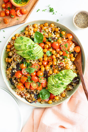 This Roasted Eggplant Couscous Salad is veggie-packed and tossed in a tangy red wine vinegar dressing. Top it off with fresh herbs & avocado | ThisSavoryVegan.com #thissavoryvegan #couscous #vegansalad