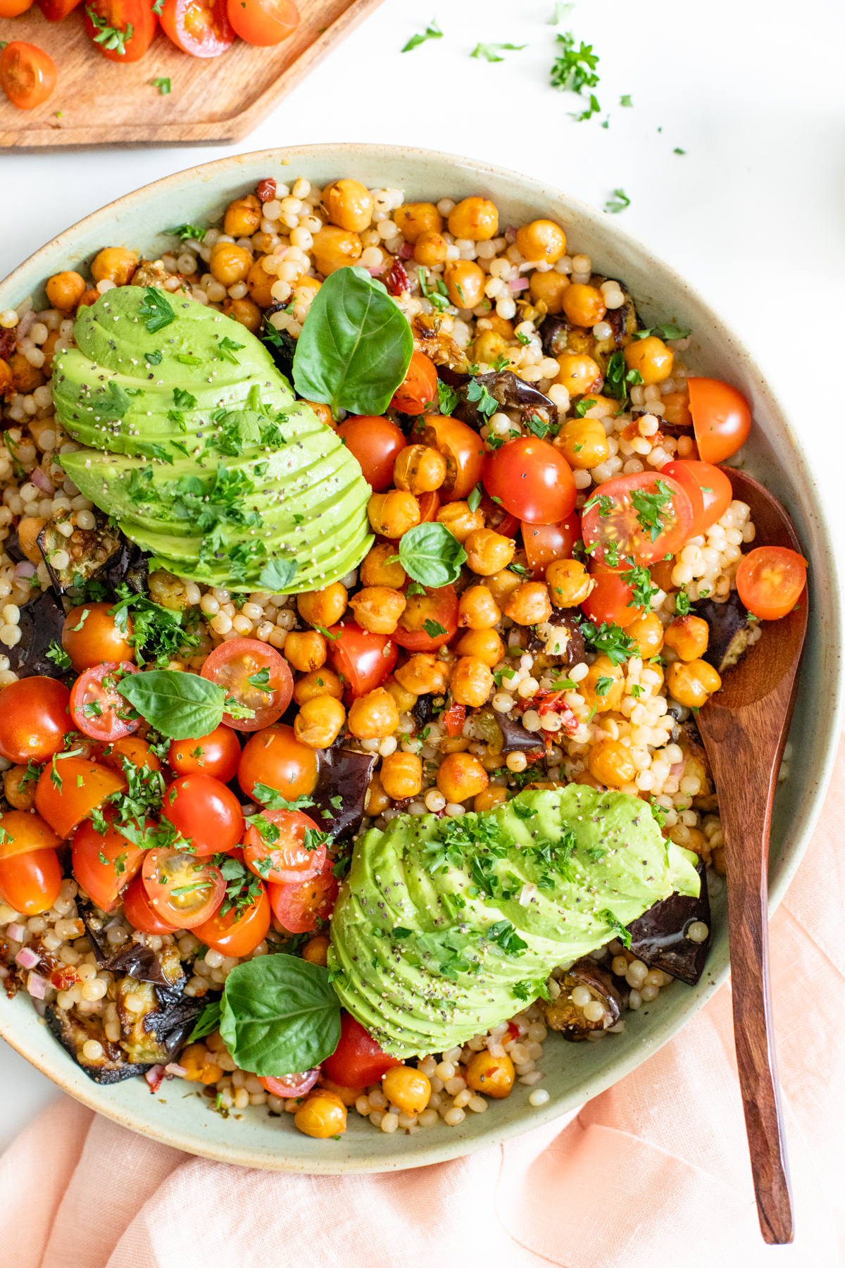This Roasted Eggplant Couscous Salad is veggie-packed and tossed in a tangy red wine vinegar dressing. Top it off with fresh herbs & avocado | ThisSavoryVegan.com #thissavoryvegan #couscous #vegansalad