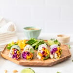 These Sesame Tofu Summer Rolls are filled with bright veggies and served with the best peanut dipping sauce! A great lunch or snack | ThisSavoryVegan.com #thissavoryvegan #summerrolls #vegansnack