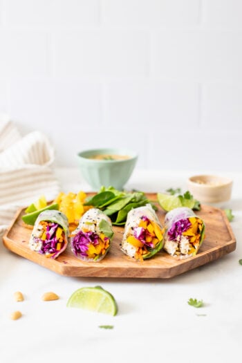 These Sesame Tofu Summer Rolls are filled with bright veggies and served with the best peanut dipping sauce! A great lunch or snack | ThisSavoryVegan.com #thissavoryvegan #summerrolls #vegansnack
