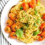 This Creamy Vegan Garlic Pasta has a simple sauce and is topped with burst tomatoes on the vine. A quick & delicious vegan dinner idea | ThisSavoryVegan.com #thissavoryvegan #veganpasta #summerpasta