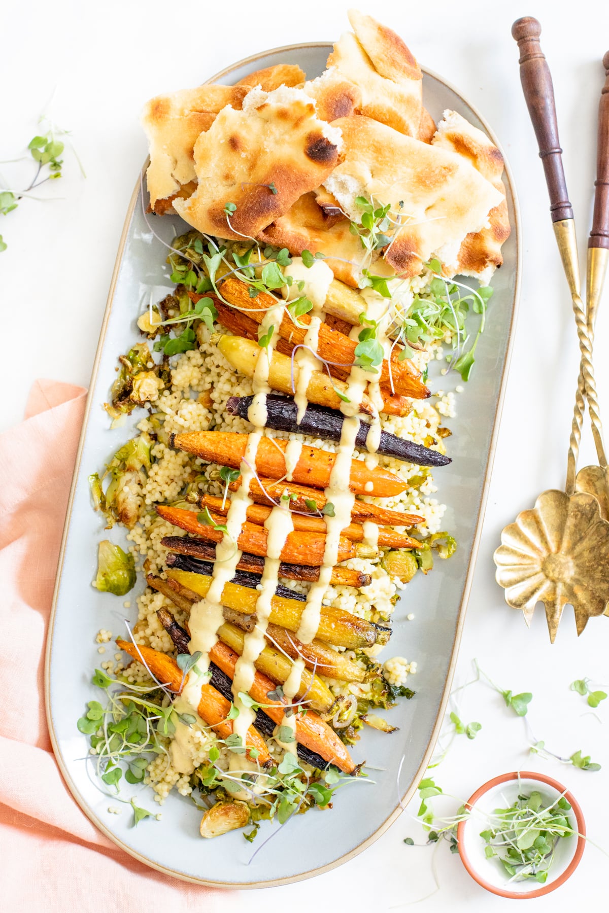 This Roasted Carrots, Brussels Sprouts & Acini Salad is the perfect lunch. Served with a mustard tahini sauce and toasted naan | ThisSavoryVegan.com #thissavoryvegan #roastedveggies #pastasalad