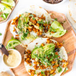 These Tempeh Soyrizo Vegan Tacos have a crispy tempeh filling, refried beans and a habanero cream sauce that adds so much flavor | ThisSavoryVegan.com #thissavoryvegan #vegantacos #tempehrecipes