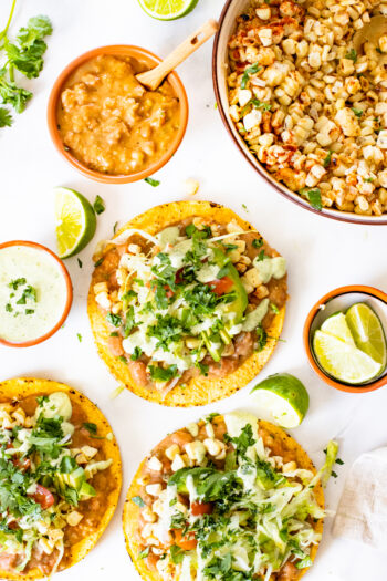 These Vegan Grilled Corn Tostadas are loaded with refried beans, charred corn and a creamy habanero sauce | ThisSavoryVegan.com #thissavoryvegan #vegandinnerideas #vegantostadas
