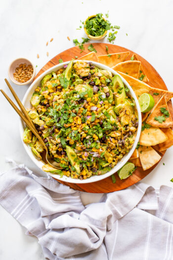 This Brussels Sprouts Corn Salad is served up with vegan chipotle ranch and is ready in just 30 minutes! A simple vegan salad that can be prepped ahead of time | ThisSavoryVegan.com #thissavoryvegan #chipotledressing #summersalad