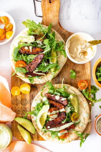 These Tempeh Caesar Salad Pitas are made with the BEST vegan caesar dressing, crispy tempeh and plenty of fresh veggies. Seriously addicting and a great vegan lunch idea | ThisSavoryVegan.com #thissavoryvegan #vegancaesarsalad #veganlunchideas