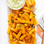 The viral recipe, but spiced up! These Air Fryer Buffalo Pasta Chips are super easy to make and are served with a side of vegan ranch | ThisSavoryVegan.com #thissavoryvegan #pastachips #tiktokrecipes
