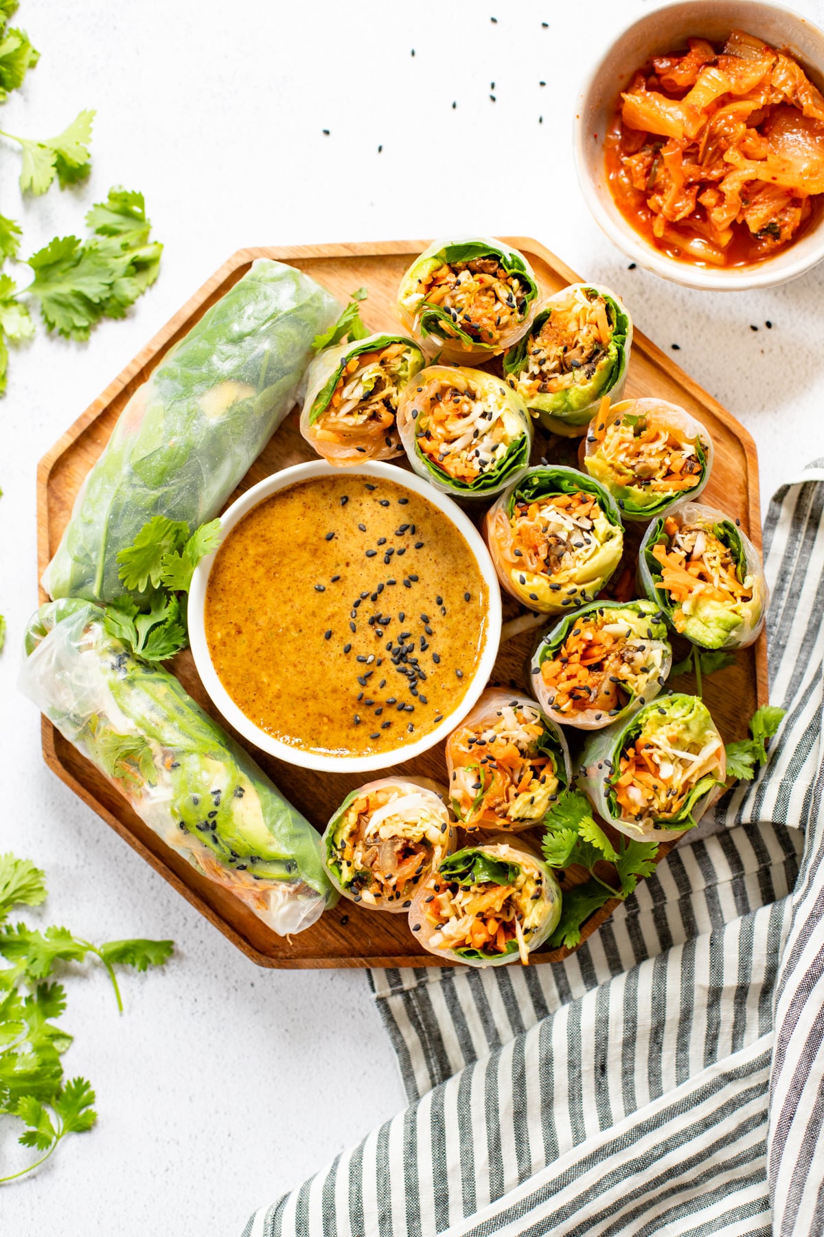 These Kimchi Summer Rolls with Almond Dipping Sauce are filled with fresh veggies, cooked mushrooms and tangy Nasoya kimchi | ThisSavoryVegan.com #thissavoryvegan #kimchi #summerrollrecipes