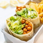 These Chickpea Caesar Salad Wraps are a great vegan lunch when you are on the go. Filled with crispy chickpeas, romaine, avocado & the best vegan caesar | ThisSavoryVegan.com #thissavoryvegan #veganwraps #veganlunchideas