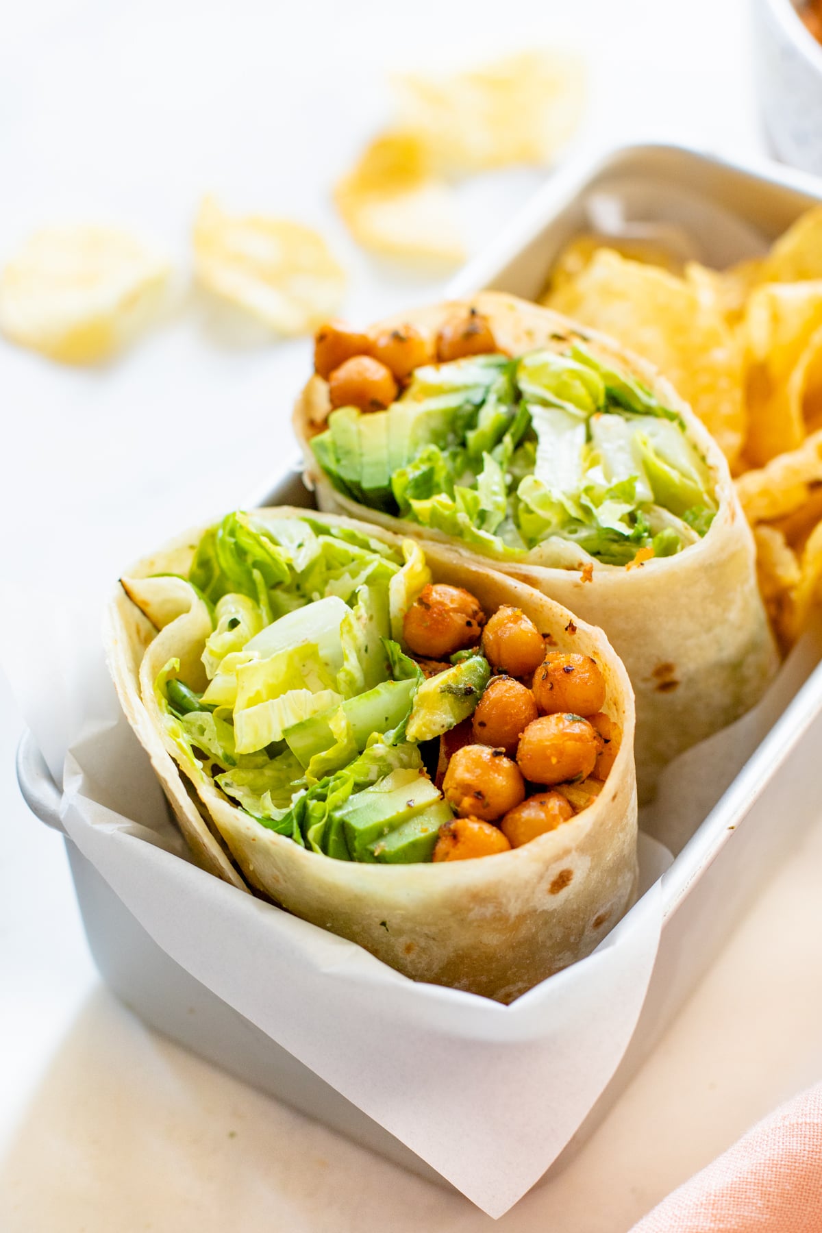 These Chickpea Caesar Salad Wraps are a great vegan lunch when you are on the go. Filled with crispy chickpeas, romaine, avocado & the best vegan caesar | ThisSavoryVegan.com #thissavoryvegan #veganwraps #veganlunchideas