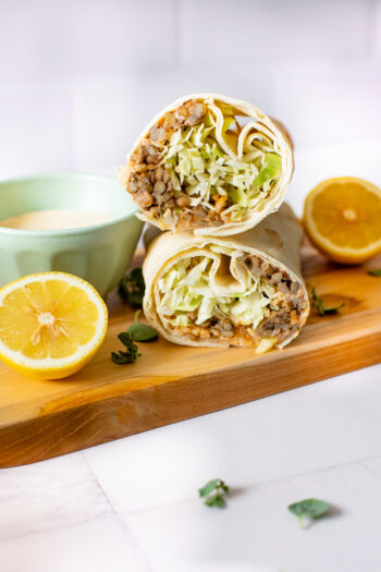 These Spicy Lentil & Rice Wraps are seasoned to perfection, loaded with crunchy cabbage and served with a tangy lemon tahini sauce | ThisSavoryVegan.com #thissavoryvegan #veganwraps #traderjoescopycatrecipe