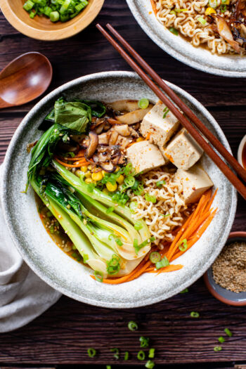 This Simple Vegan Ramen is comfort in a bowl. Crispy mushrooms & shallots, tofu, bok choy and a tasty vegan broth! A must make! | ThisSavoryVegan.com #thissavoryvegan #veganramen #fallrecipes