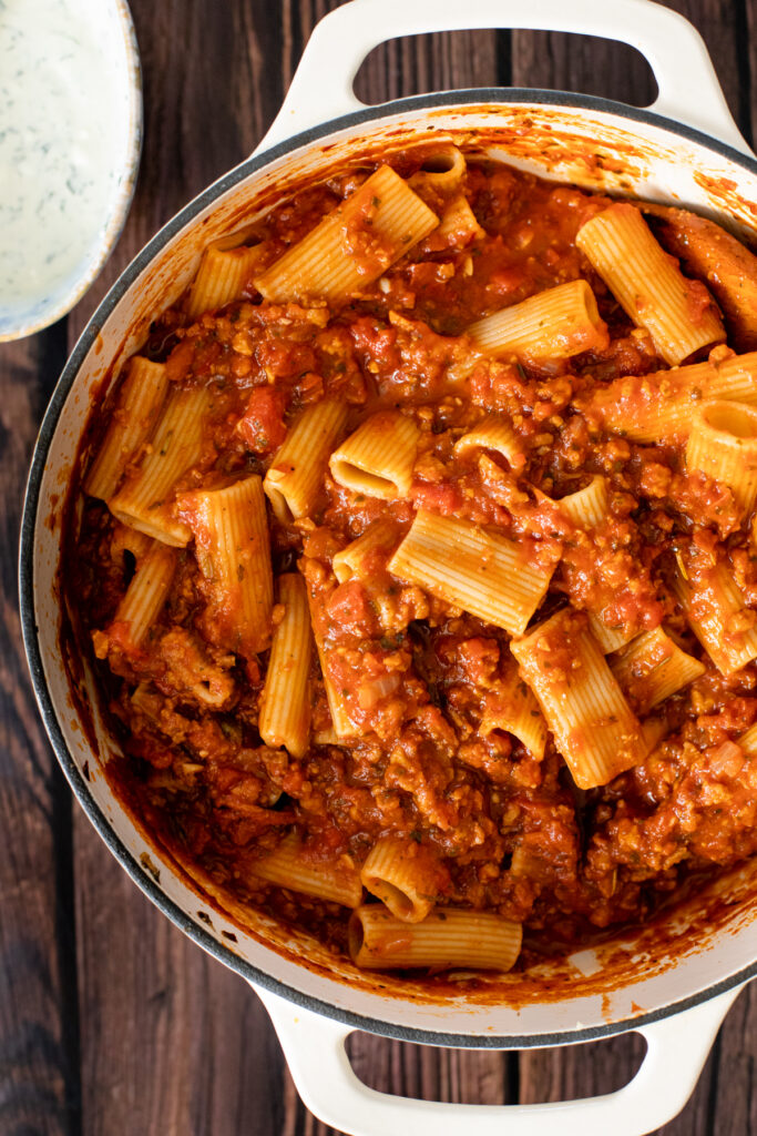 Comfort food in a casserole dish - this Vegan Baked Rigatoni Bolognese is the perfect family dinner! A simple and flavorful vegan dinner idea | ThisSavoryVegan.com #thissavoryvegan #veganpasta #pastabake