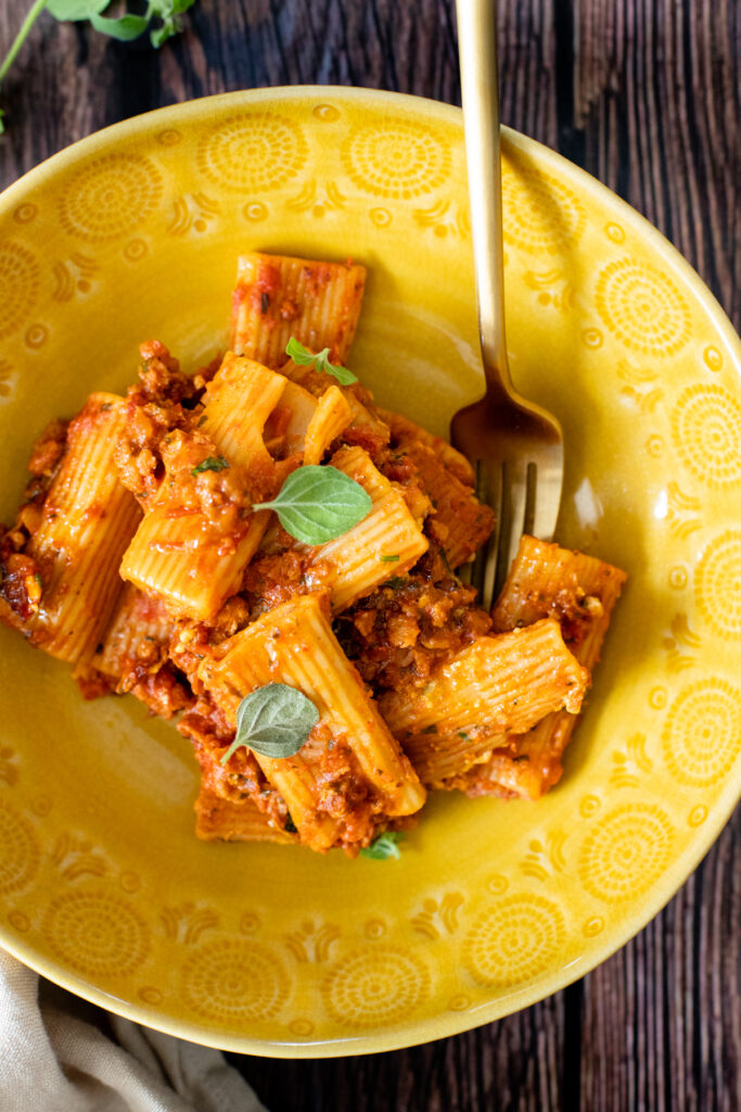Comfort food in a casserole dish - this Vegan Baked Rigatoni Bolognese is the perfect family dinner! A simple and flavorful vegan dinner idea | ThisSavoryVegan.com #thissavoryvegan #veganpasta #pastabake