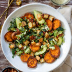This Brussels & Kale Vegan Caesar is loaded with sweet potatoes, tempeh bacon, homemade croutons, avocado and the BEST caesar dressing | ThisSavoryVegan.com #vegancaesar #fallsalads #falldinnerideas